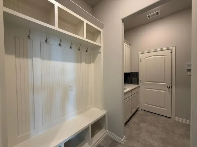 a view of a kitchen counter top space with furniture and fireplace