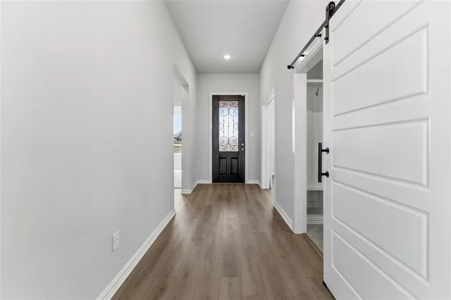 a large kitchen with kitchen island a sink a center island stainless steel appliances and a center island