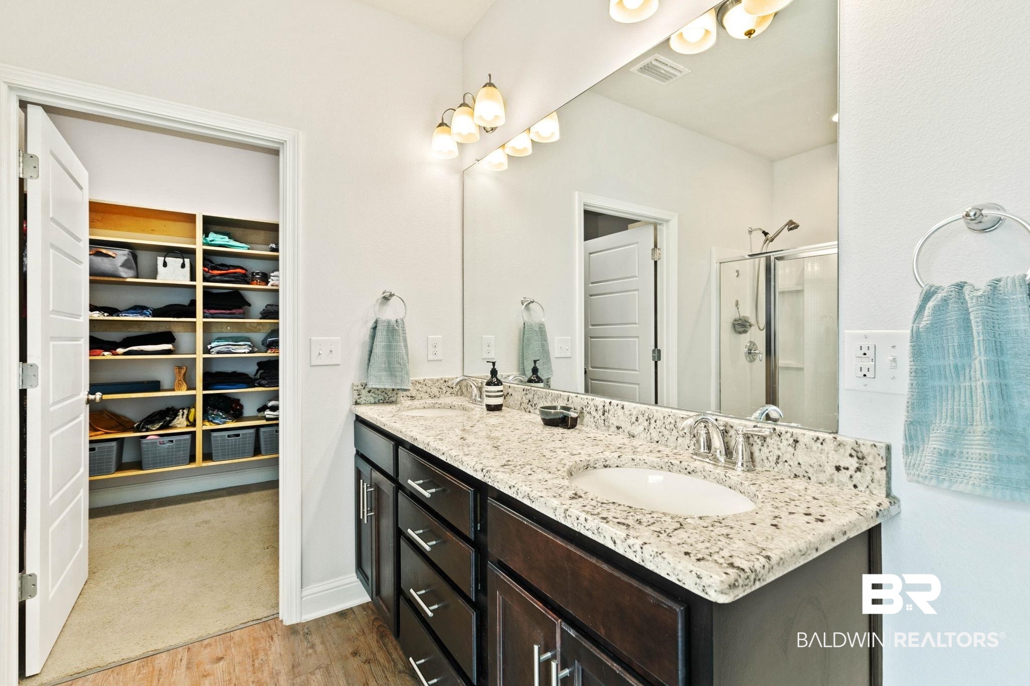 31350 Hoot Owl Road Daphne, AL 36527 - Photo 29 of 94 Full bath with a spacious closet, double vanity, a stall shower, and light wood-style floors