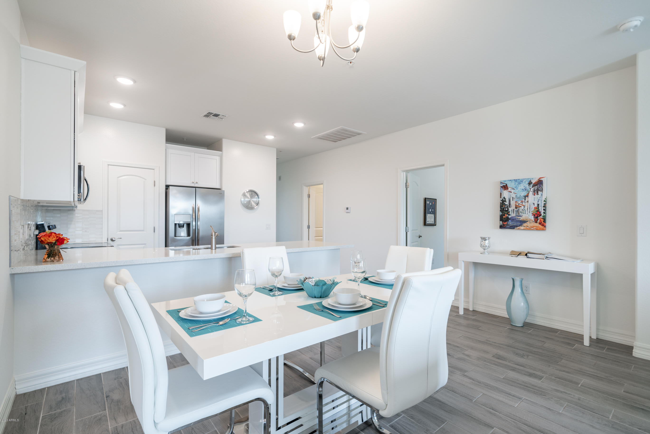 7820 East Baseline Road, Unit 208 Mesa, AZ 85209 - Photo 11 of 29 a view of kitchen with cabinets and wooden floor