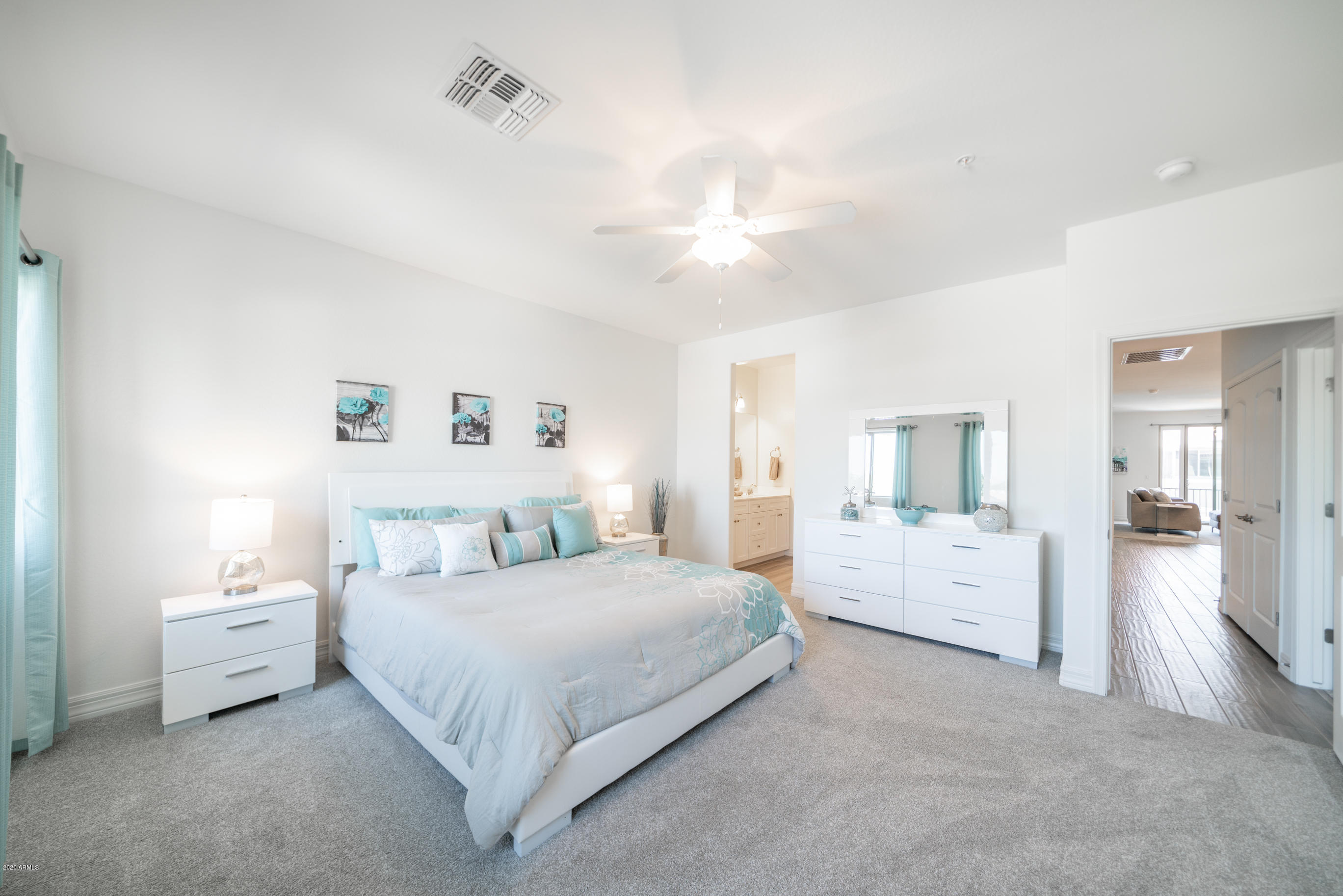 7820 East Baseline Road, Unit 208 Mesa, AZ 85209 - Photo 19 of 29 a bedroom with bed and white cabinets