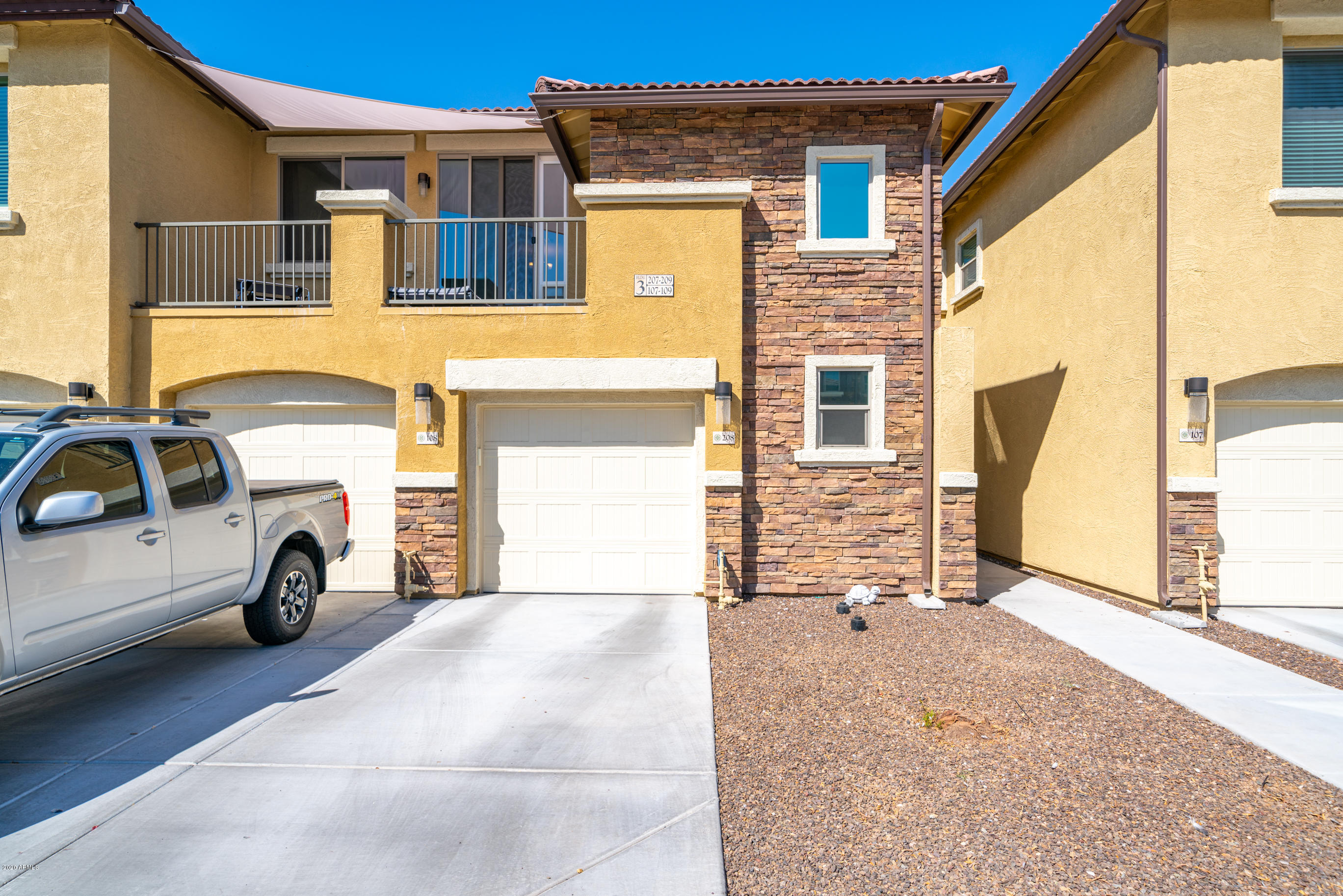 7820 East Baseline Road, Unit 208 Mesa, AZ 85209 - Photo 2 of 29 a view of a car park front of a house