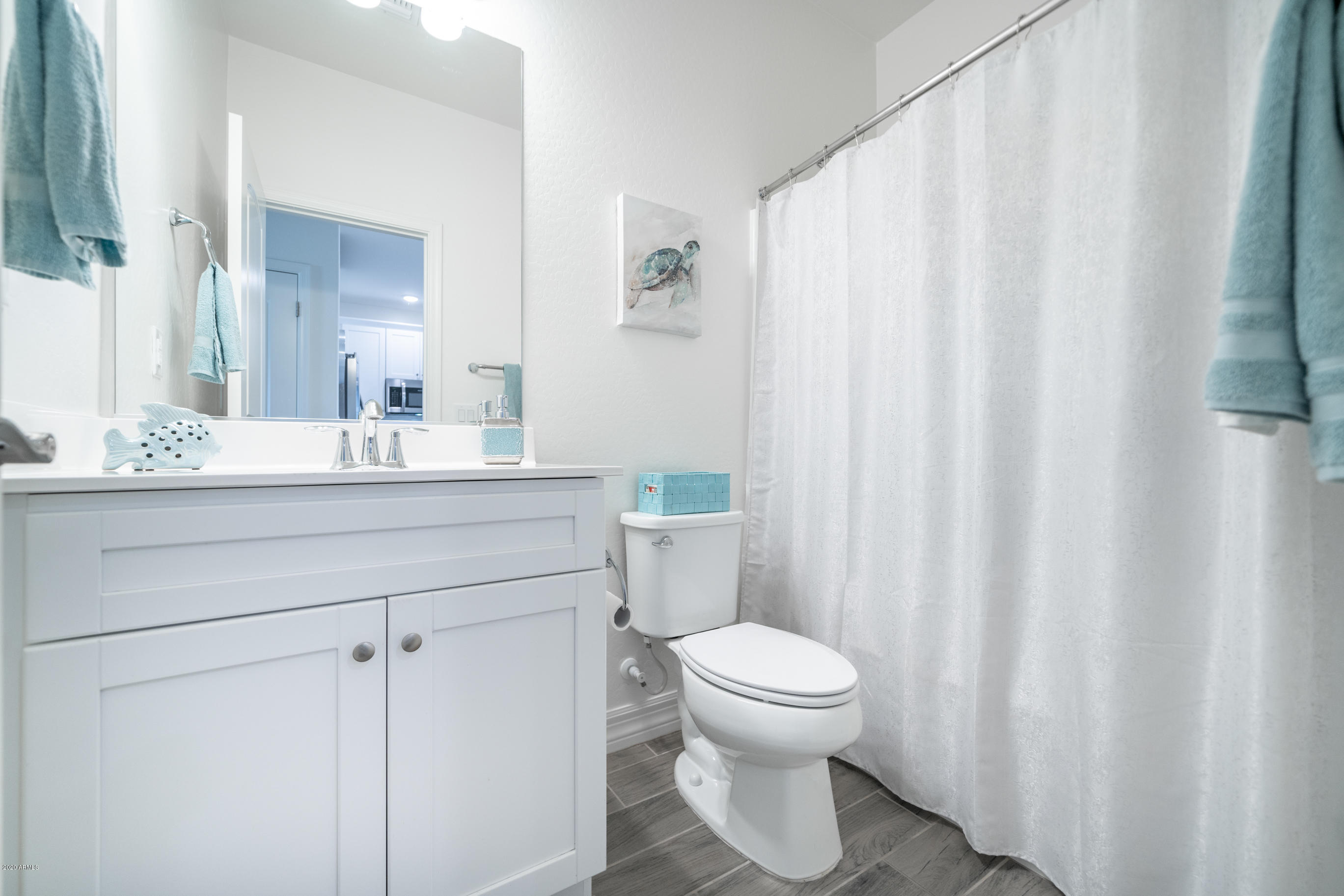 7820 East Baseline Road, Unit 208 Mesa, AZ 85209 - Photo 25 of 29 a bathroom with a sink a toilet and a mirror
