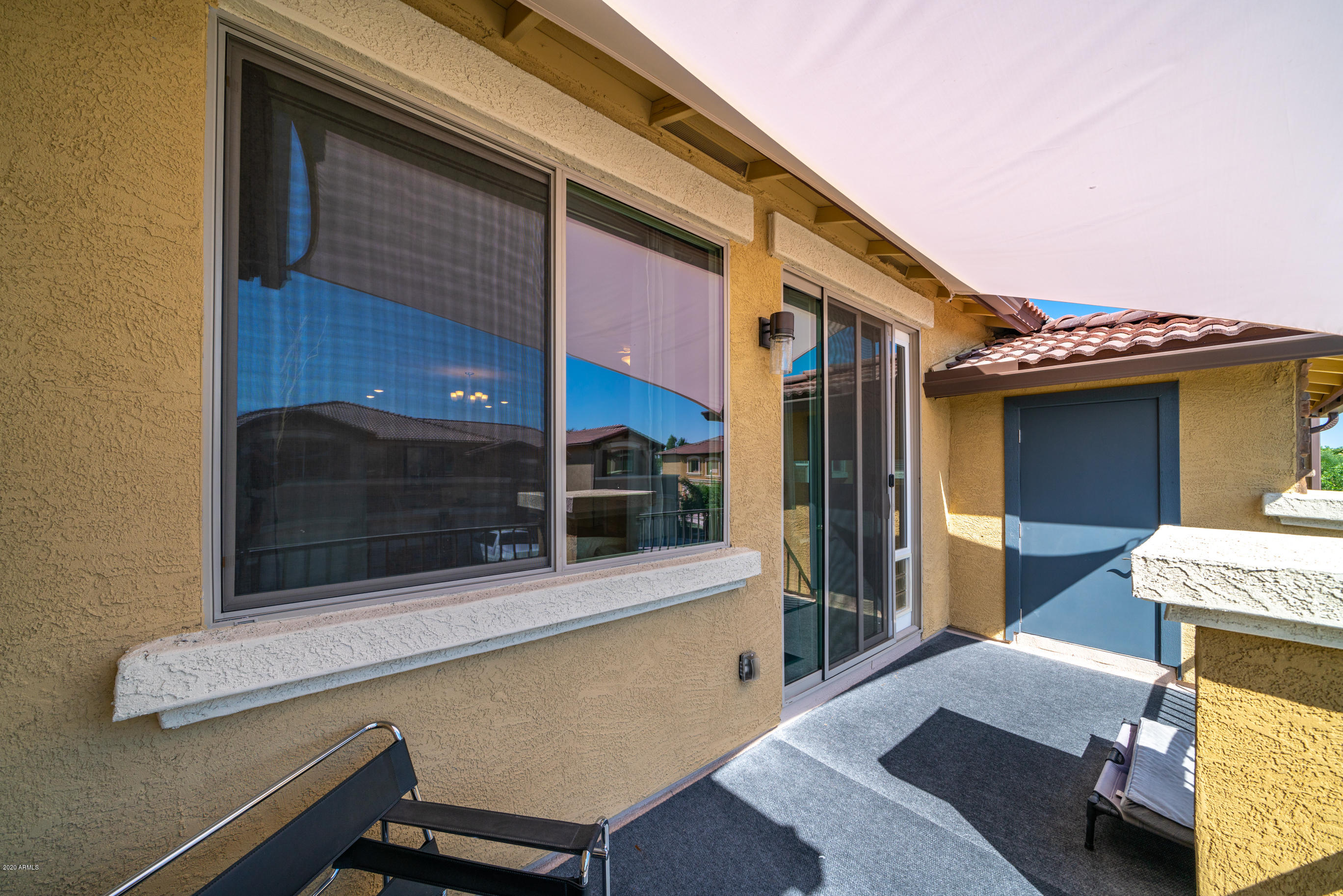 7820 East Baseline Road, Unit 208 Mesa, AZ 85209 - Photo 28 of 29 a balcony with table and chairs