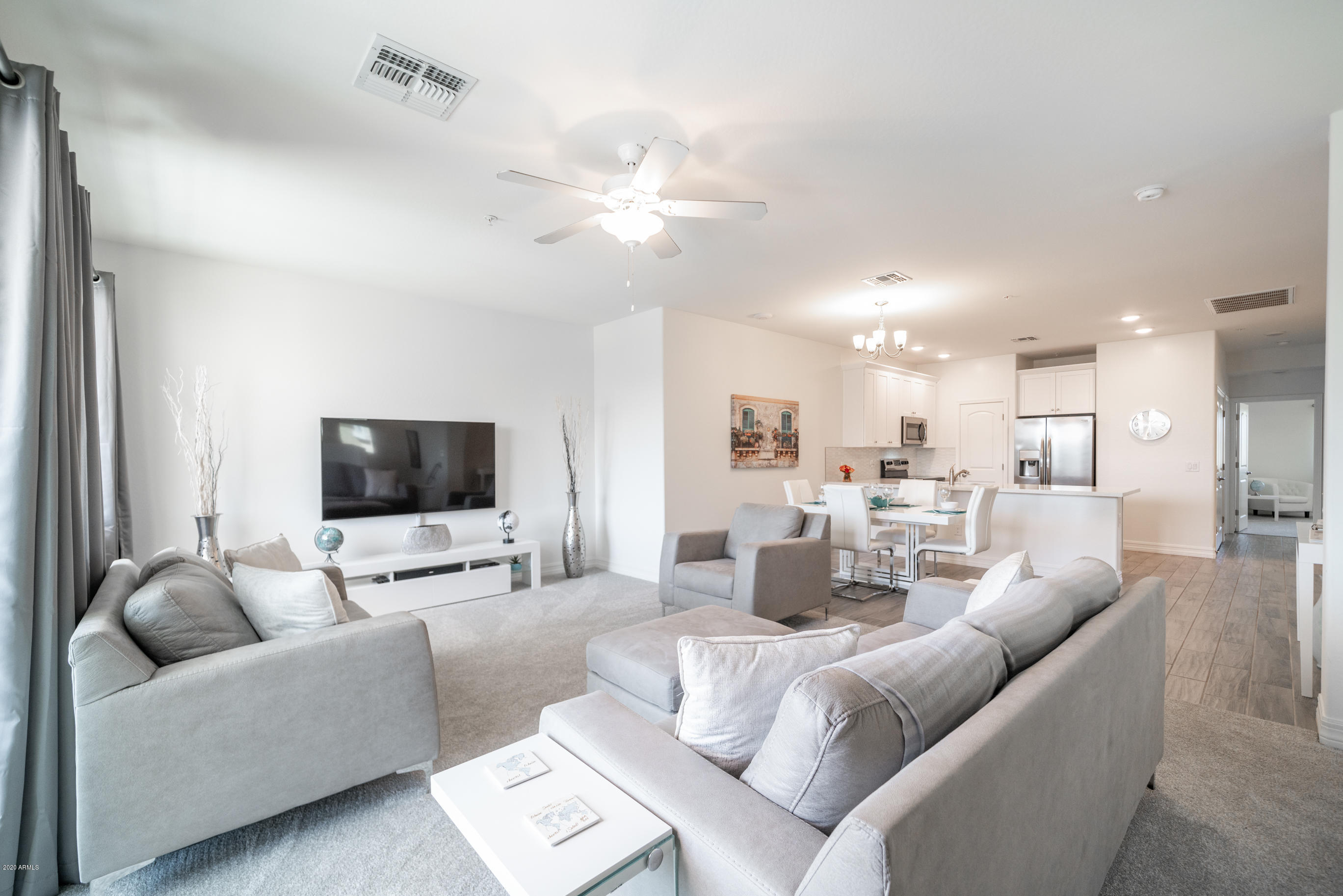 7820 East Baseline Road, Unit 208 Mesa, AZ 85209 - Photo 7 of 29 a living room with furniture and a flat screen tv