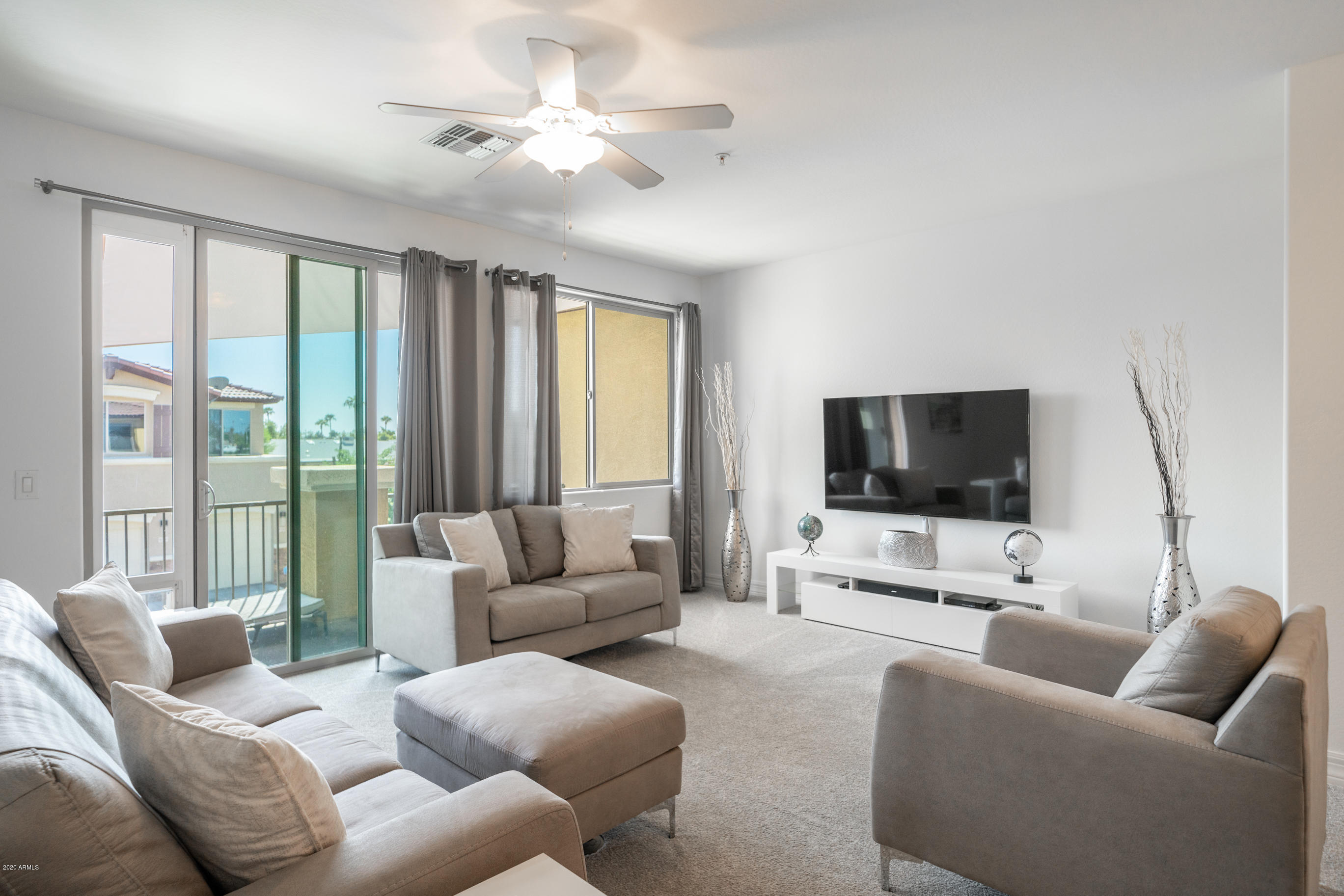 7820 East Baseline Road, Unit 208 Mesa, AZ 85209 - Photo 8 of 29 a living room with furniture and a flat screen tv