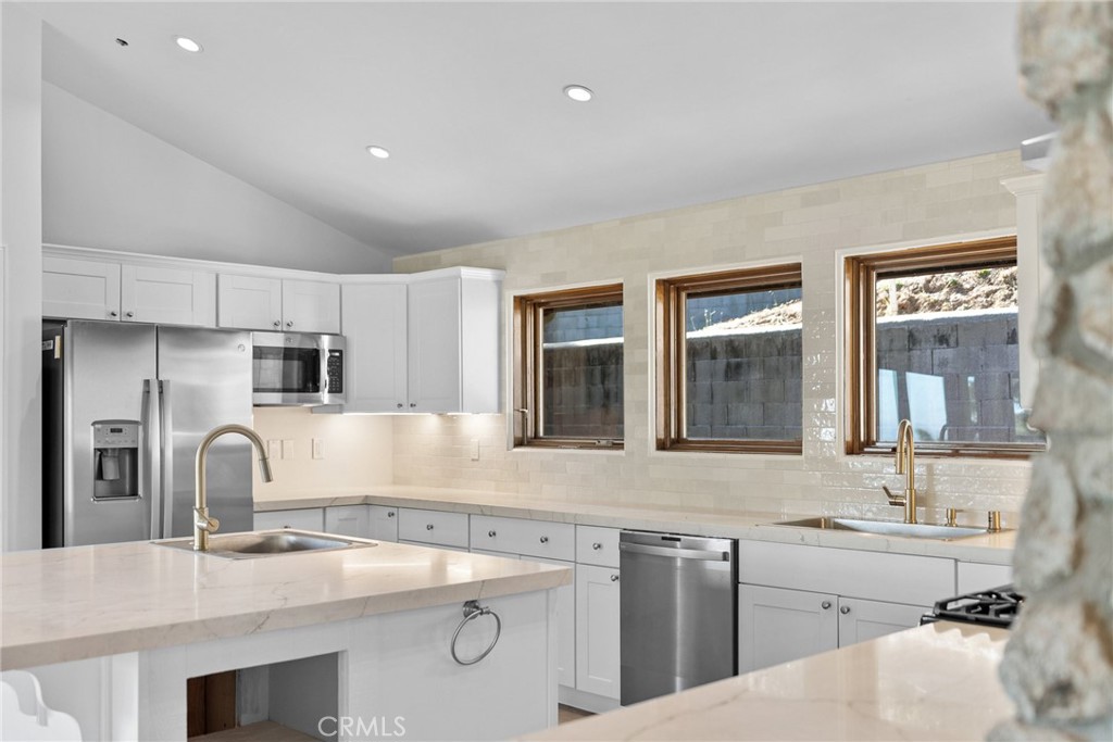 51422 Partington Ridge Road Big Sur, CA 93920 - Photo 3 of 36 a kitchen with stainless steel appliances granite countertop a sink and dishwasher a refrigerator with wooden cabinets