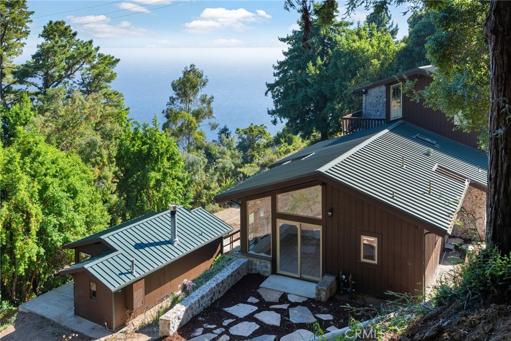 51422 Partington Ridge Road Big Sur, CA 93920 - Photo 33 of 36 a view of a patio with wooden floor and a bench