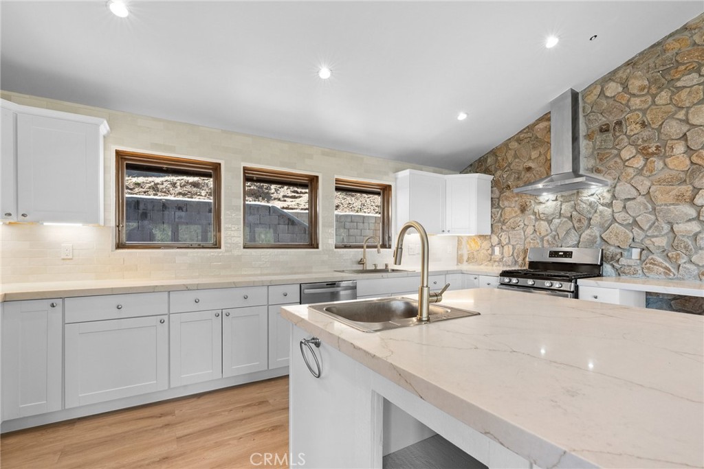 51422 Partington Ridge Road Big Sur, CA 93920 - Photo 5 of 36 a kitchen with sink stove and cabinets