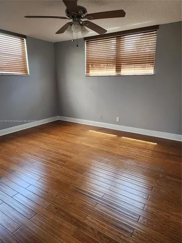 a view of outdoor space with wooden floor