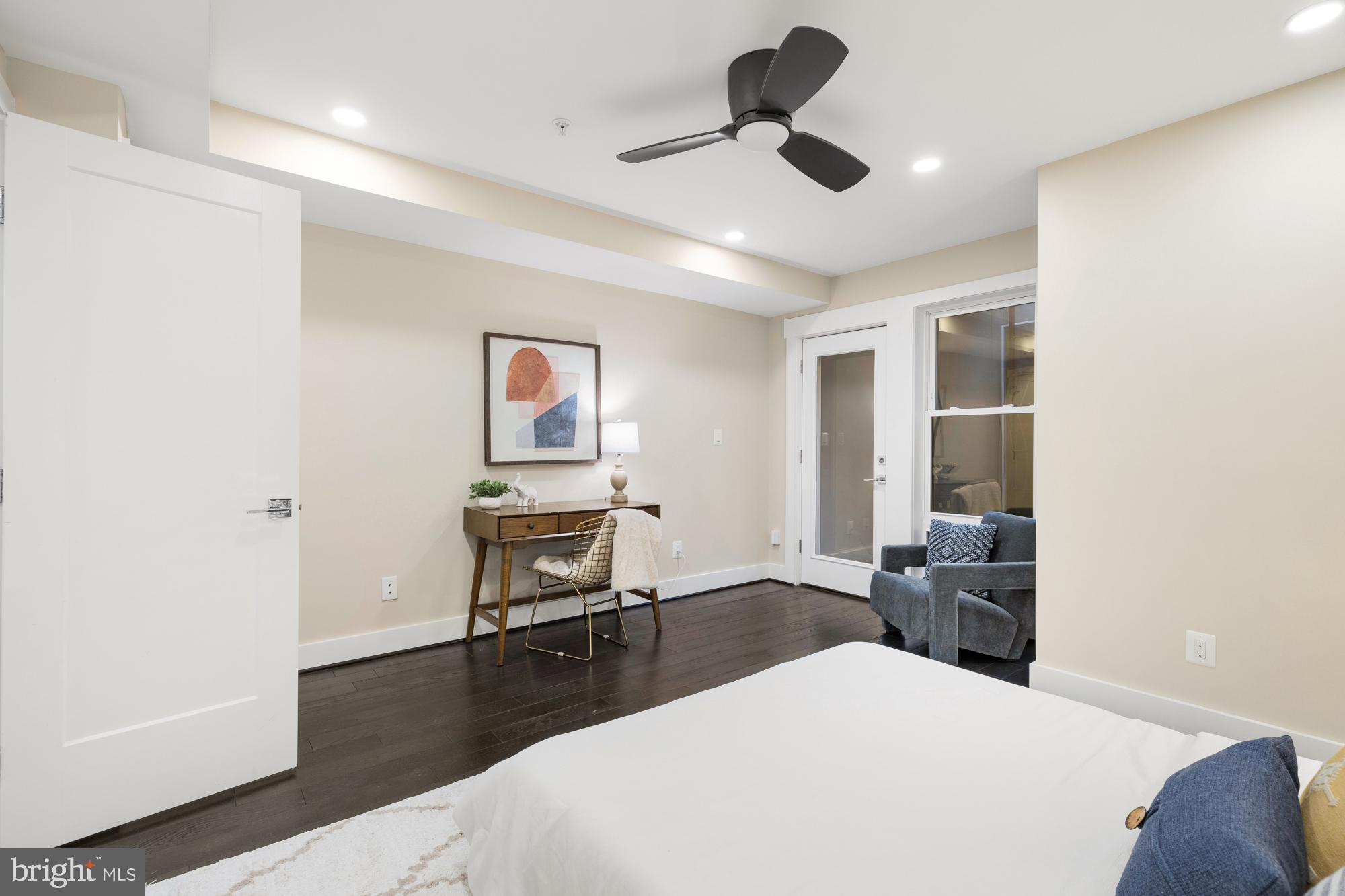 1503 K Street Southeast, Unit C01 Washington, DC 20003 - Photo 12 of 16 a bedroom with a bed and a chair