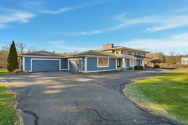 a view of a big house with a swimming pool