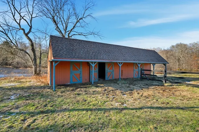 a view of house with yard