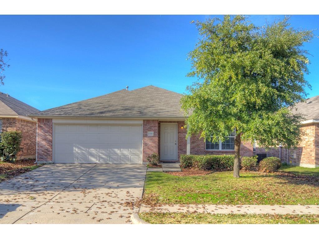 13109 Fieldstone Road Fort Worth, TX 76244 - Photo 1 of 25 View of front of property with a garage, concrete driveway, a front yard, and brick siding