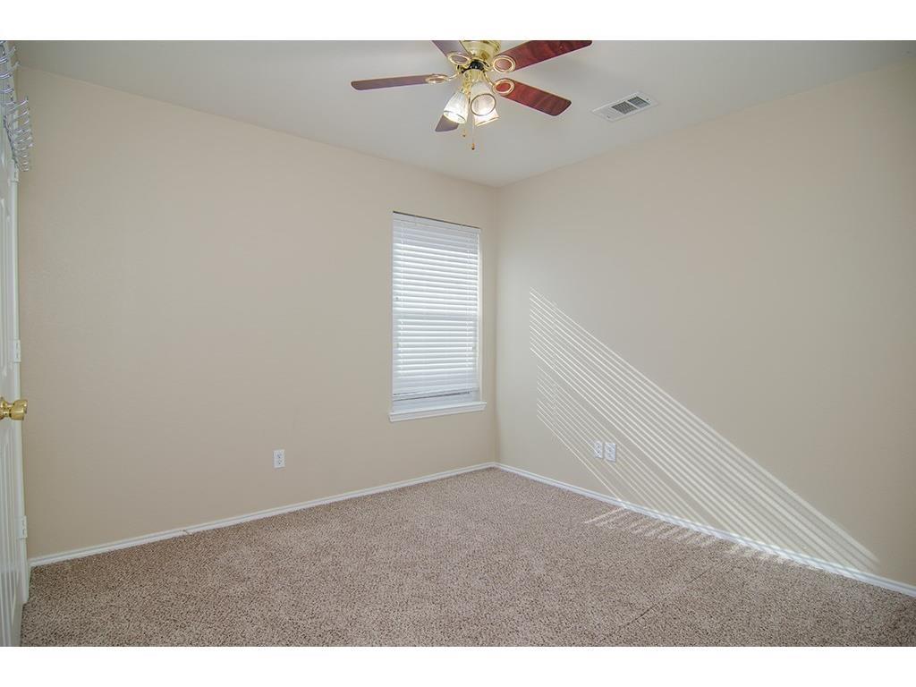 13109 Fieldstone Road Fort Worth, TX 76244 - Photo 3 of 25 Spare room featuring light colored carpet and ceiling fan