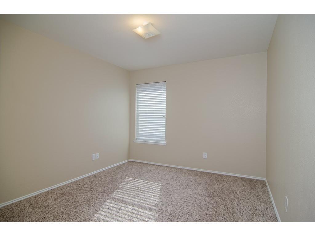 13109 Fieldstone Road Fort Worth, TX 76244 - Photo 5 of 25 Unfurnished room with light colored carpet and baseboards