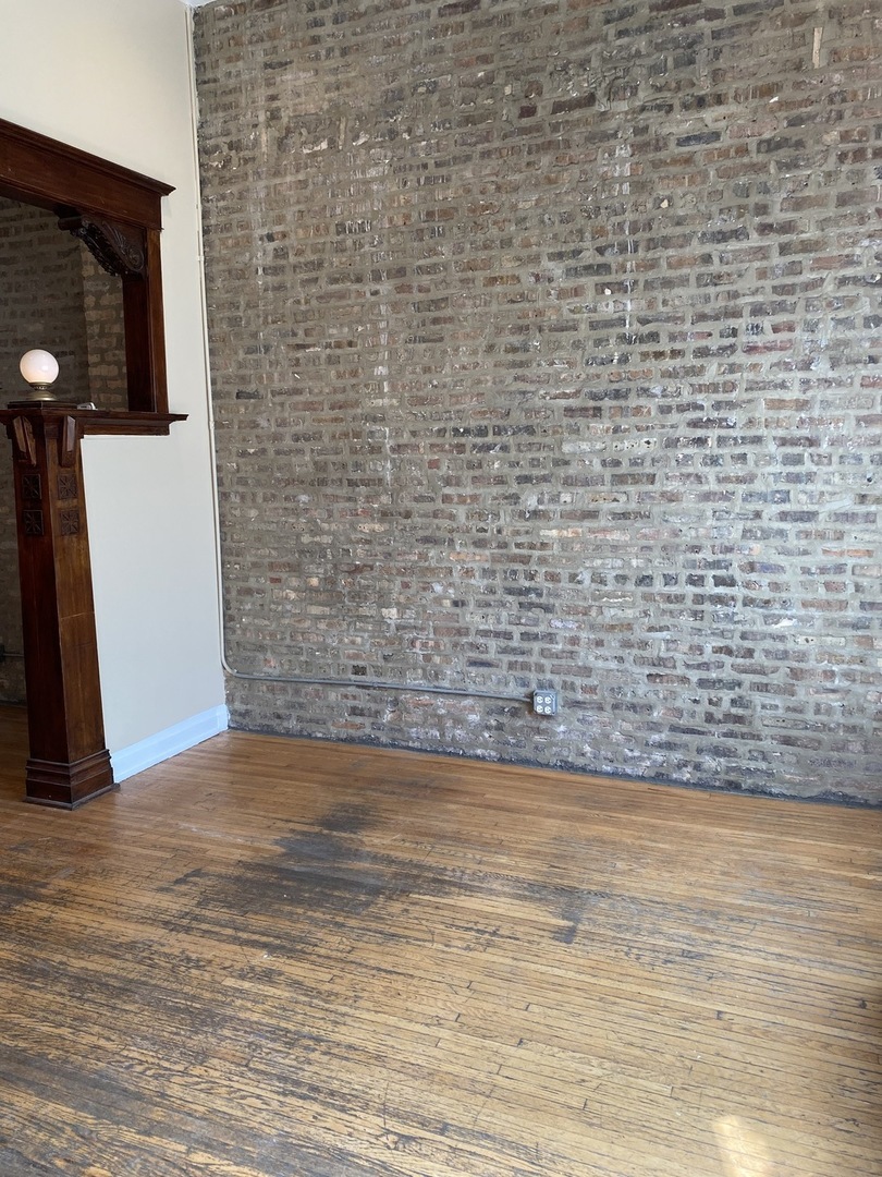 2252 West Cermak Road, Unit 2 Chicago, IL 60608 - Photo 9 of 10 a view of empty room with wooden floor