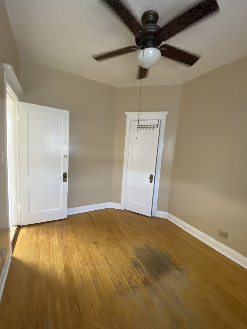 2252 West Cermak Road, Unit 2 Chicago, IL 60608 - Photo 10 of 10 a view of an empty room with wooden floor