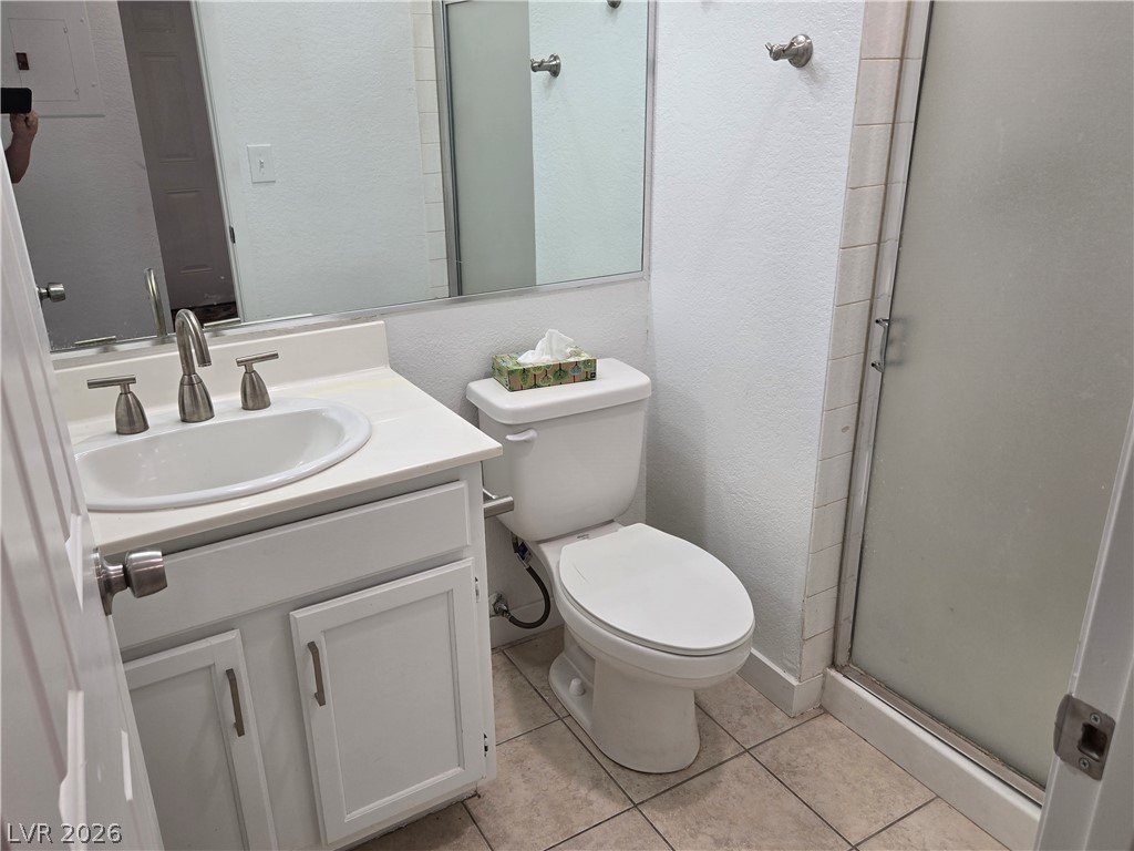6250 West Flamingo Road, Unit 131 Las Vegas, NV 89103 - Photo 11 of 11 A compact bathroom offers essential fixtures and tiled flooring for everyday functionality.