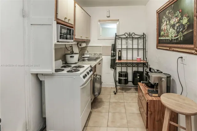 a kitchen with stainless steel appliances granite countertop a stove and a refrigerator