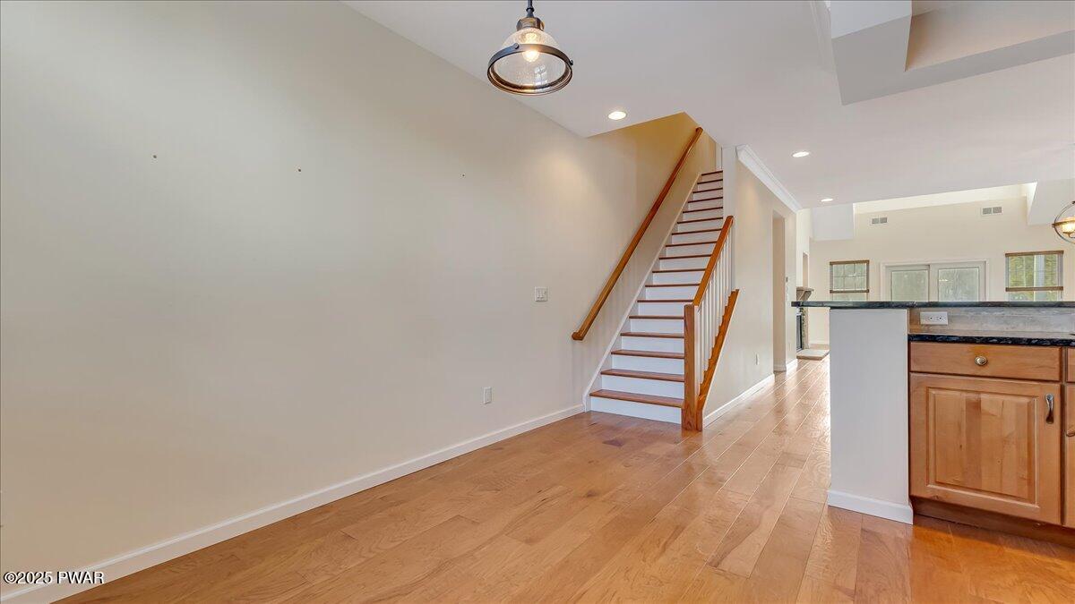 1010 MacIntosh Way Matamoras, PA 18336 - Photo 23 of 60 a view of a hallway with wooden floor and staircase