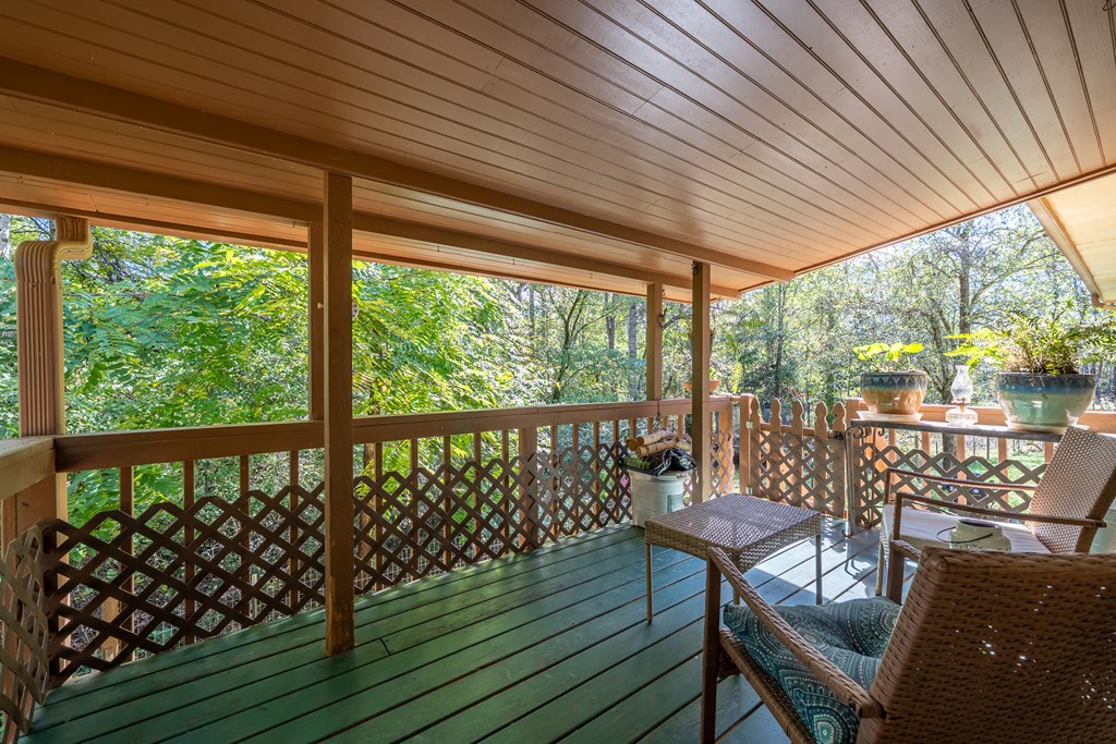 1813 John Smith Road East Blairsville, GA 30512 - Photo 25 of 41 a view of a porch with furniture and wooden deck