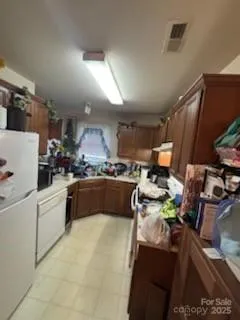 a kitchen with a sink appliances and cabinets