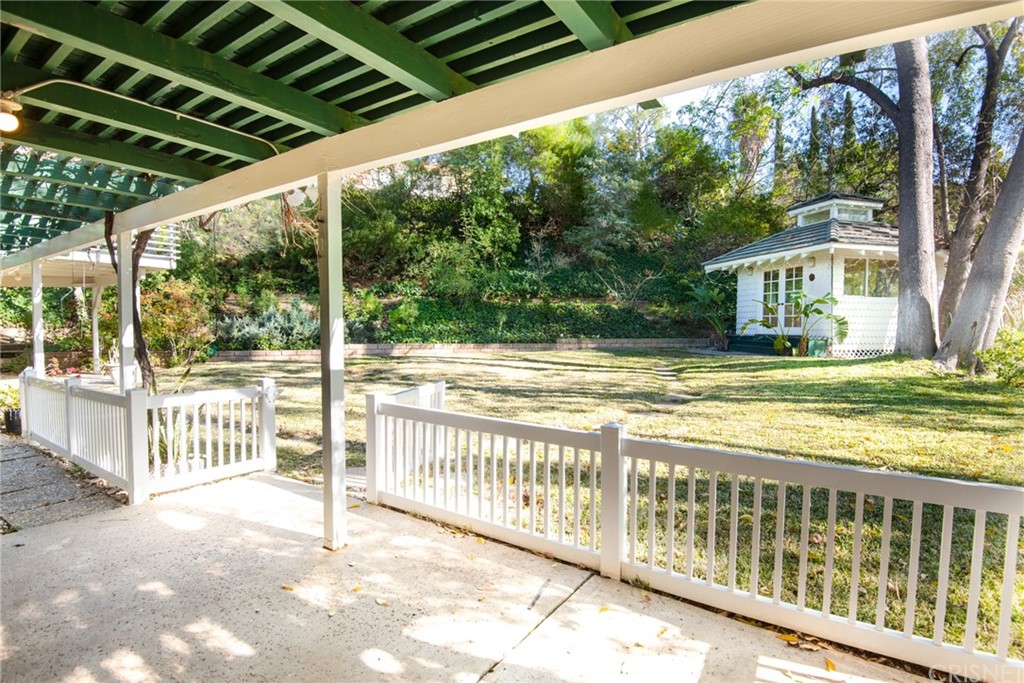 20140 Adele Drive Woodland Hills, CA 91364 - Photo 16 of 20 a view of a house with backyard and floor to ceiling window