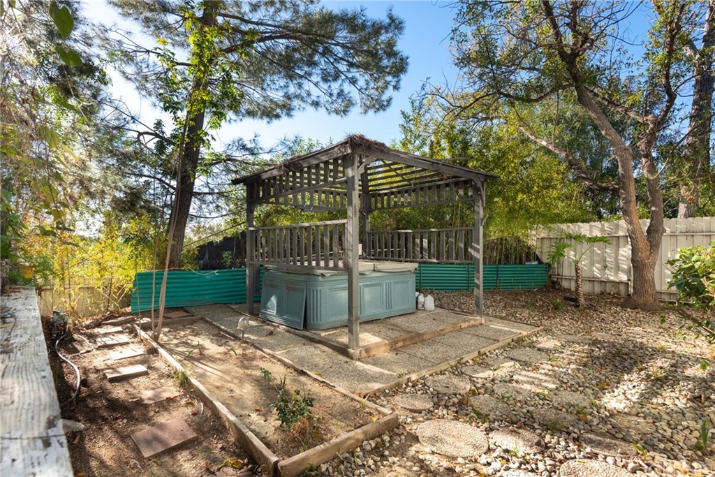 20140 Adele Drive Woodland Hills, CA 91364 - Photo 20 of 20 a view of a yard with a table and a chair