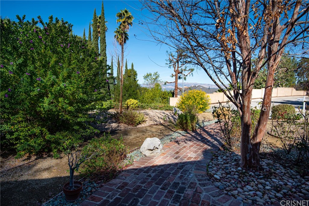 20140 Adele Drive Woodland Hills, CA 91364 - Photo 4 of 20 a backyard of a house with lots of green space