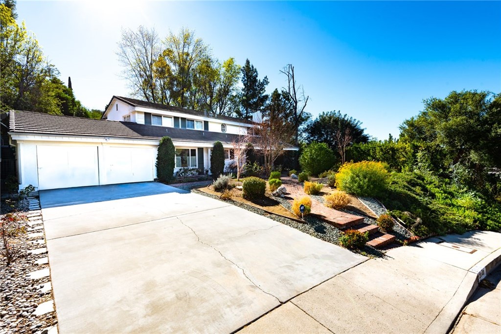 20140 Adele Drive Woodland Hills, CA 91364 - Photo 5 of 20 a backyard of a house with table and chairs