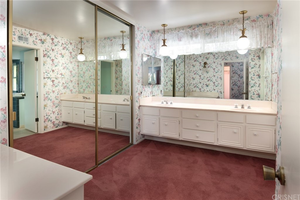 20140 Adele Drive Woodland Hills, CA 91364 - Photo 8 of 20 a spacious bathroom with a shower sink and a mirror