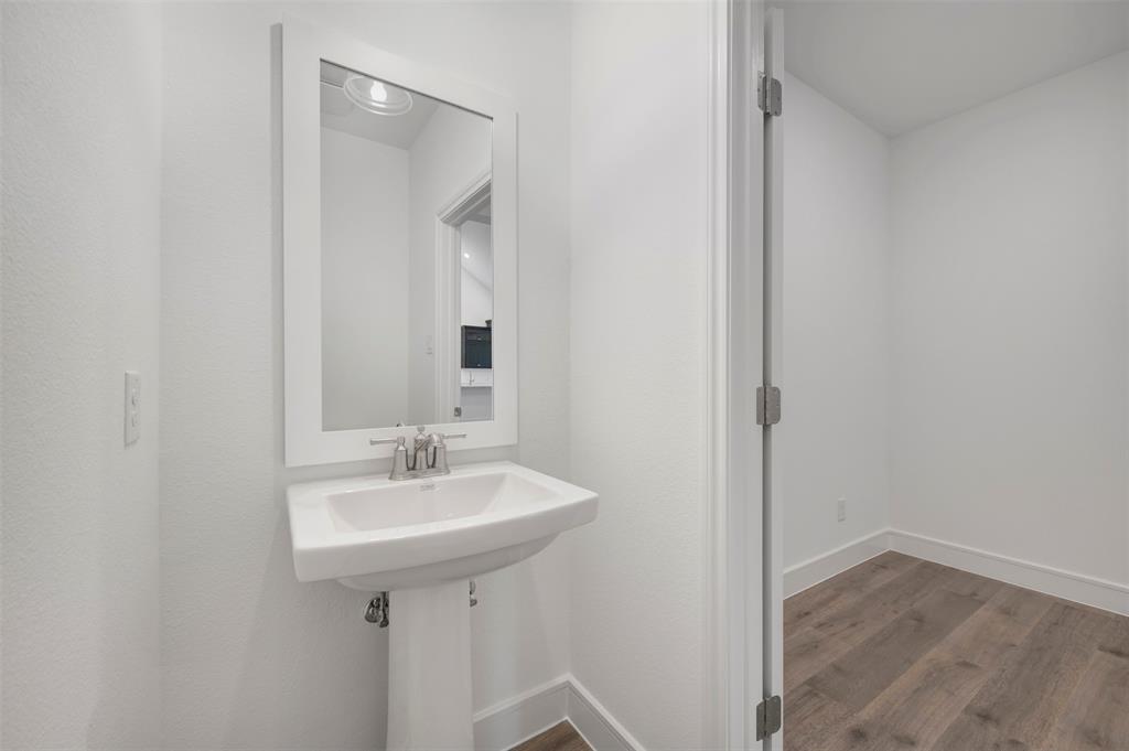 1004 Ashcroft Lane Justin, TX 76247 - Photo 23 of 39 a bathroom with a sink and a mirror