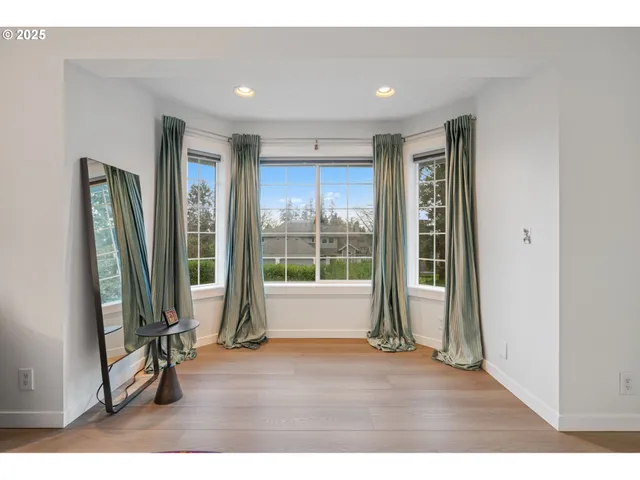 a view of livingroom with furniture and floor to ceiling window