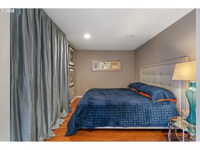 a bedroom with bed and window