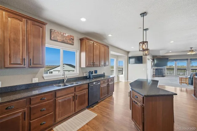 a view of an empty room with a fireplace