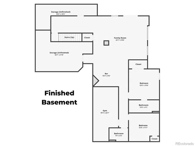 a view of a big room with wooden floor and windows