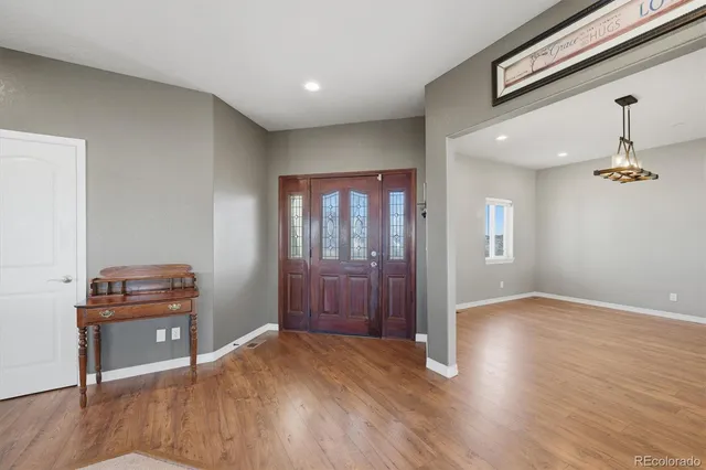 a view of a livingroom with a fireplace and window