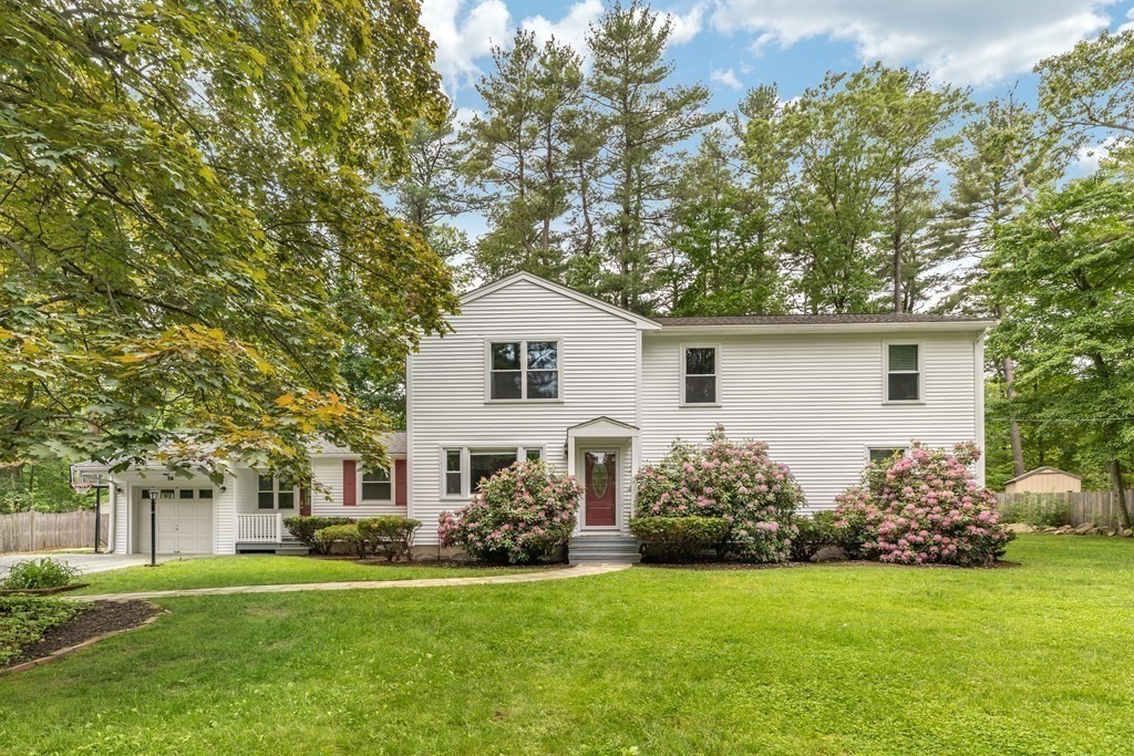 24 Oxbow Road Lexington, MA 02421 - Photo 1 of 28 a front view of a house with garden