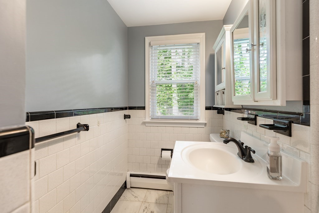 24 Oxbow Road Lexington, MA 02421 - Photo 12 of 28 a bathroom with a sink and a window