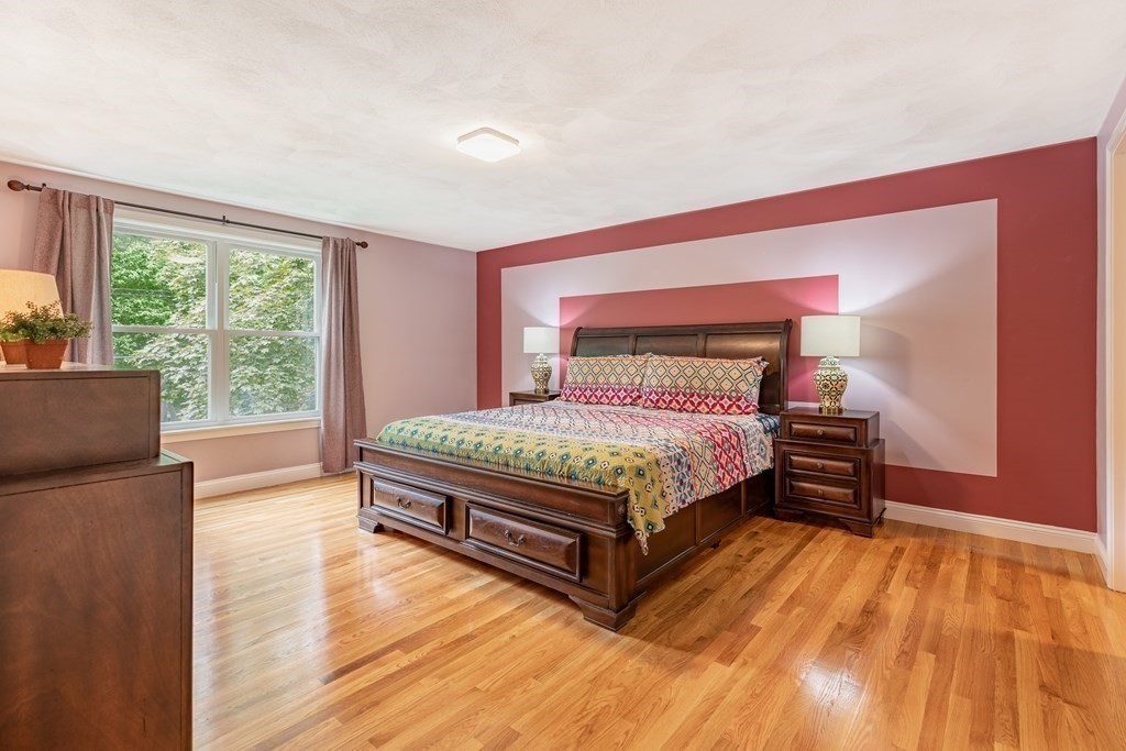 24 Oxbow Road Lexington, MA 02421 - Photo 13 of 28 a bedroom with a bed and wooden floor
