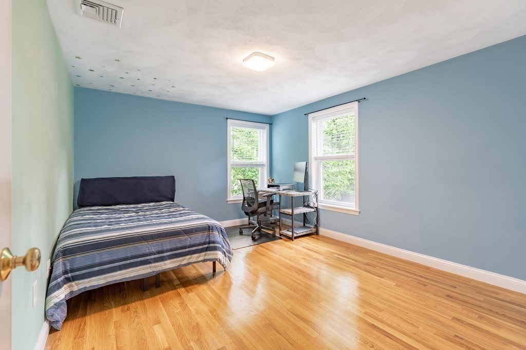 24 Oxbow Road Lexington, MA 02421 - Photo 16 of 28 a bedroom with a bed and large window