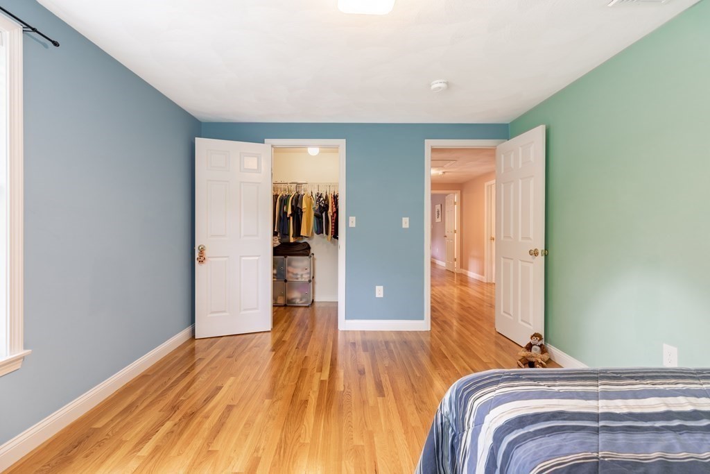 24 Oxbow Road Lexington, MA 02421 - Photo 17 of 28 a bedroom with a bed and wooden floor