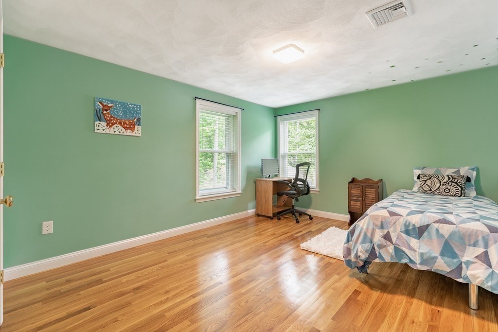 24 Oxbow Road Lexington, MA 02421 - Photo 18 of 28 a bedroom with a bed and a window