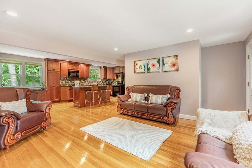 24 Oxbow Road Lexington, MA 02421 - Photo 2 of 28 a living room with furniture and a flat screen tv