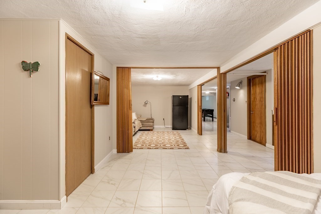 24 Oxbow Road Lexington, MA 02421 - Photo 23 of 28 a view of a hallway with a livingroom and a bathroom