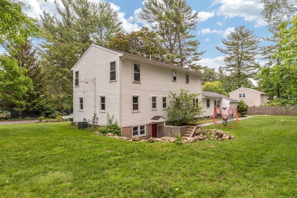 24 Oxbow Road Lexington, MA 02421 - Photo 25 of 28 a view of a house with a yard