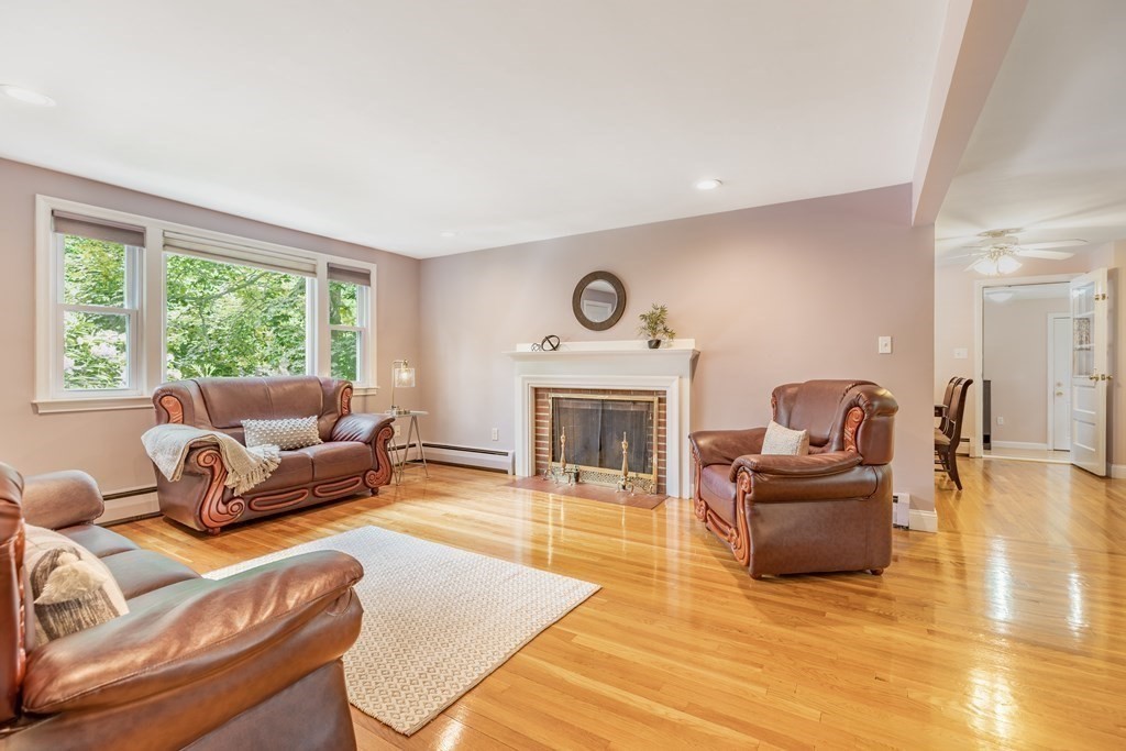 24 Oxbow Road Lexington, MA 02421 - Photo 3 of 28 a living room with furniture and a fireplace