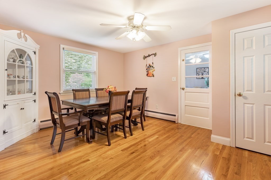 24 Oxbow Road Lexington, MA 02421 - Photo 7 of 28 a view of a dining room with furniture and wooden floor