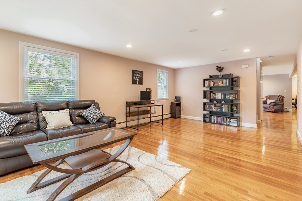 24 Oxbow Road Lexington, MA 02421 - Photo 9 of 28 a living room with furniture and wooden floor